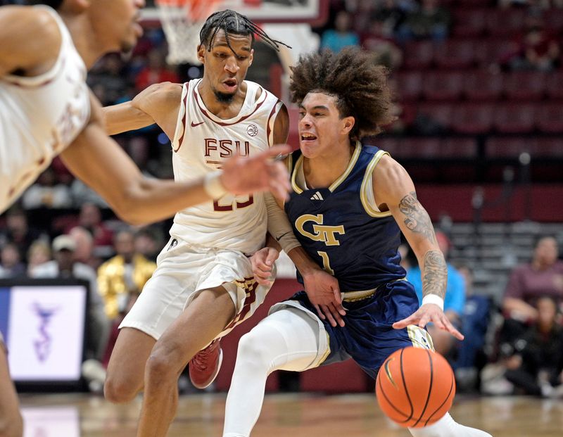 Jan 18, 2025; Tallahassee, Florida, USA; Georgia Tech Yellowjackets guard Naithan George (1) drives the ball against Florida State Seminoles guard Justin Thomas (25) during the second half at Donald L. Tucker Center. Mandatory Credit: Robert Myers-Imagn Images