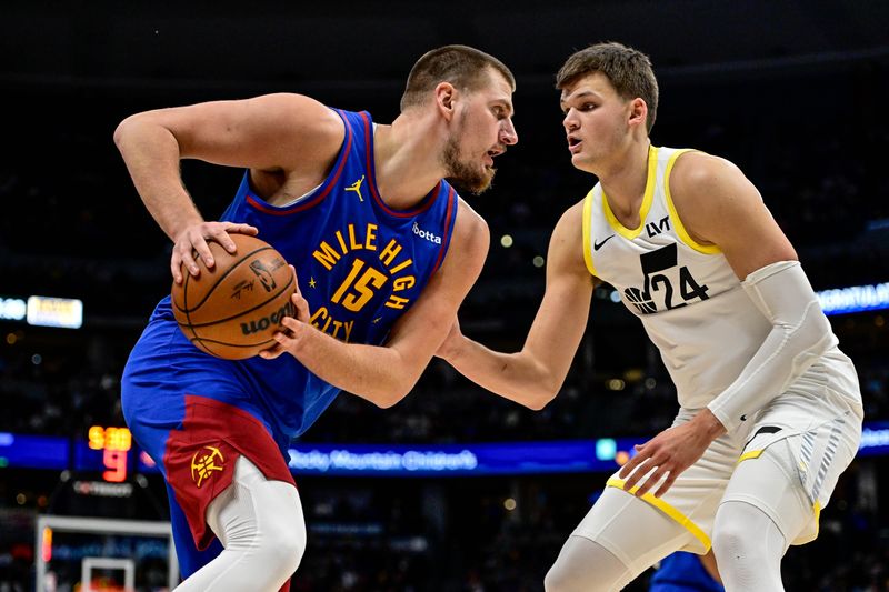 DENVER, COLORADO - NOVEMBER 02: Nikola Jokic #15 of the Denver Nuggets is defended by Walker Kessler #24 of the Utah Jazz in the first half at Ball Arena on November 2, 2024, 2024 in Denver, Colorado. NOTE TO USER: User expressly acknowledges and agrees that, by downloading and or using this photograph, User is consenting to the terms and conditions of the Getty Images License Agreement. (Photo by Dustin Bradford/Getty Images)