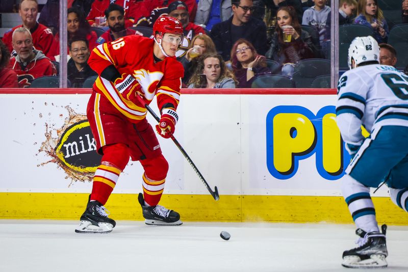 Apr 12, 2023; Calgary, Alberta, CAN; Calgary Flames defenseman Nikita Zadorov (16) passes the puck against the San Jose Sharks during the third period at Scotiabank Saddledome. Mandatory Credit: Sergei Belski-USA TODAY Sports