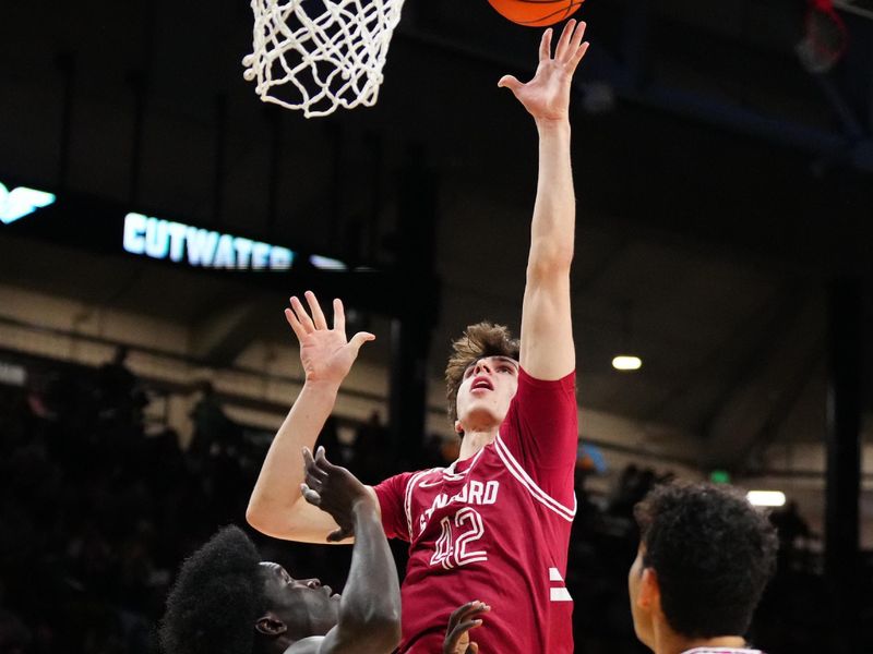 Mar 3, 2024; Boulder, Colorado, USA; Stanford Cardinal forward Maxime Raynaud (42) shoots over Colorado Buffaloes forward Assane Diop (35) in the first half at the CU Events Center. Mandatory Credit: Ron Chenoy-USA TODAY Sports