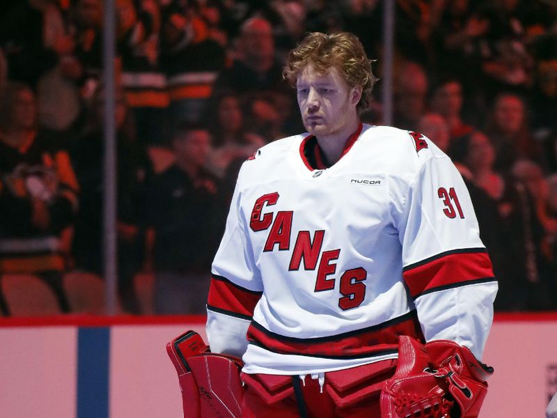 Oct 18, 2024; Pittsburgh, Pennsylvania, USA;  Carolina Hurricanes goaltender Frederik Andersen (31) stands for the national anthem against thePittsburgh Penguins at PPG Paints Arena. Mandatory Credit: Charles LeClaire-Imagn Images