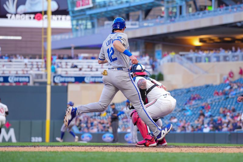 May 28, 2024; Minneapolis, Minnesota, USA; Kansas City Royals second base Nick Loftin (12) scores against the Minnesota Twins in the fifth inning at Target Field. Mandatory Credit: Brad Rempel-USA TODAY Sports