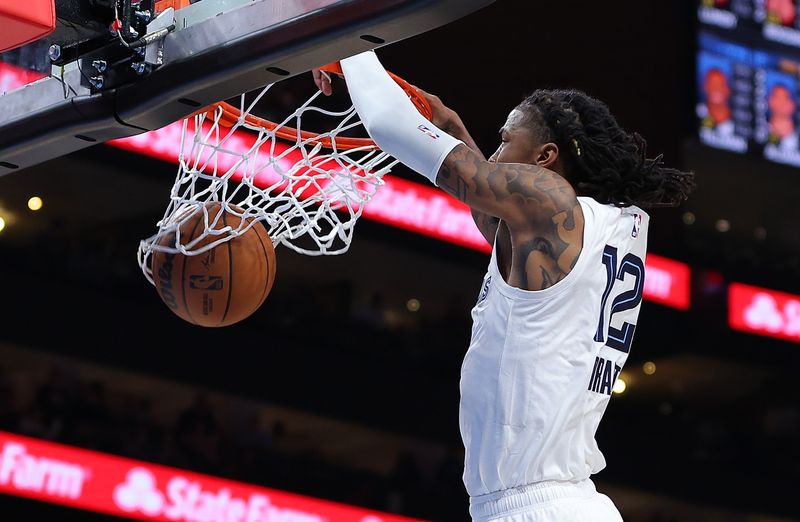 ATLANTA, GEORGIA - DECEMBER 23:  Ja Morant #12 of the Memphis Grizzlies dunks against the Atlanta Hawks during the third quarter at State Farm Arena on December 23, 2023 in Atlanta, Georgia.  NOTE TO USER: User expressly acknowledges and agrees that, by downloading and/or using this photograph, user is consenting to the terms and conditions of the Getty Images License Agreement. (Photo by Kevin C. Cox/Getty Images)