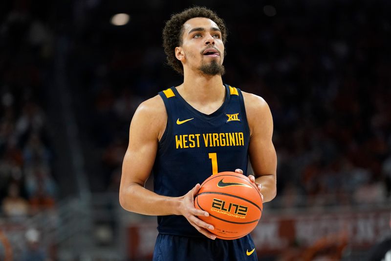 Feb 11, 2023; Austin, Texas, USA; West Virginia Mountaineers forward Emmitt Matthews Jr. (1) shoots a free throw during the first half against the Texas Longhorns at Moody Center. Mandatory Credit: Scott Wachter-USA TODAY Sports