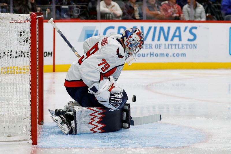 Nov 15, 2024; Denver, Colorado, USA; Washington Capitals goaltender Charlie Lindgren (79) makes a save in the second period against the Colorado Avalanche at Ball Arena. Mandatory Credit: Isaiah J. Downing-Imagn Images