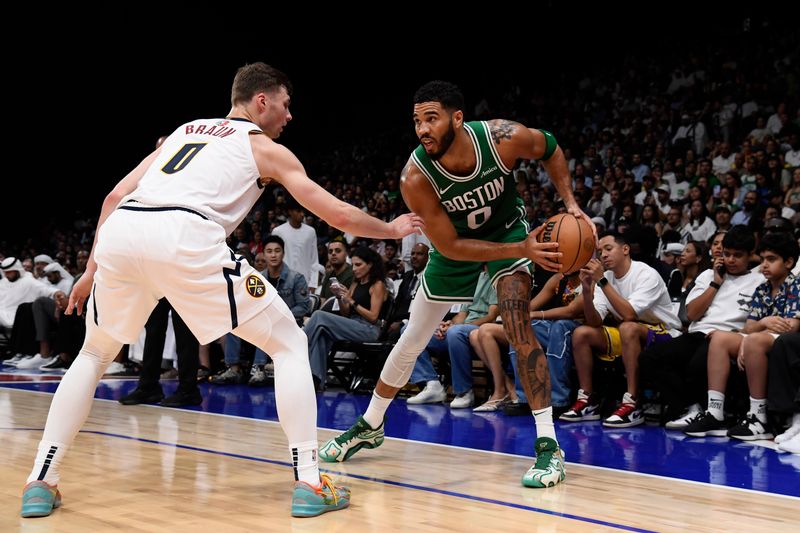 ABU DHABI, UAE - OCTOBER 6: Jayson Tatum #0 of the Boston Celtics handles the ball during the game against the Denver Nuggets during the 2024 Global Games on October 6, 2024 at the Etihad Arena in Abu Dhabi, United Arab Emirates. NOTE TO USER: User expressly acknowledges and agrees that, by downloading and/or using this Photograph, user is consenting to the terms and conditions of the Getty Images License Agreement. Mandatory Copyright Notice: Copyright 2024 NBAE (Photo by Brian Babineau/NBAE via Getty Images)