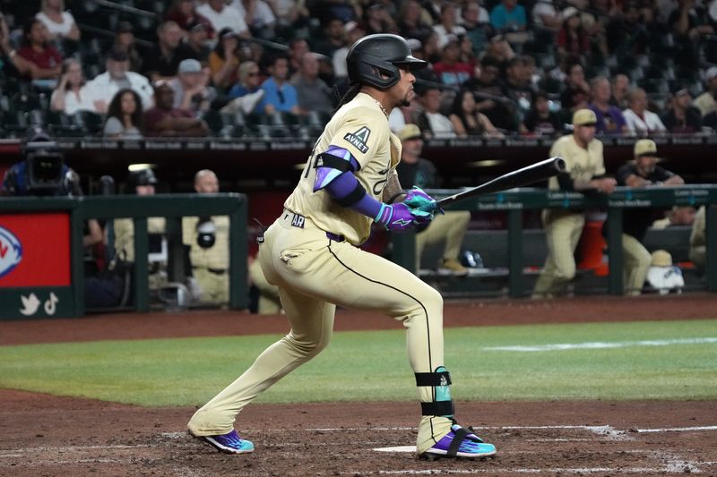 Sep 24, 2024; Phoenix, Arizona, USA; Arizona Diamondbacks second base Ketel Marte (4) hits against the San Francisco Giants in the ninth inning at Chase Field. Mandatory Credit: Rick Scuteri-Imagn Images