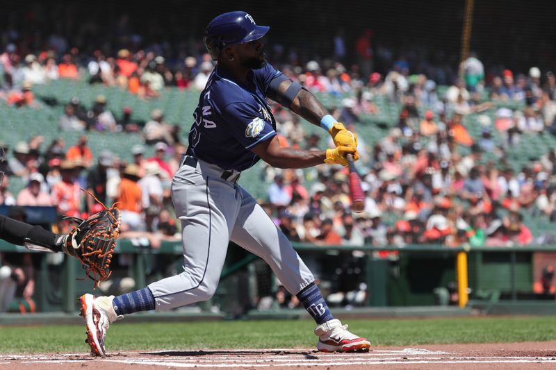 Aug 16, 2023; San Francisco, California, USA; Tampa Bay Rays left fielder Randy Arozarena (56) hits a single during the first inning against the San Francisco Giants at Oracle Park. Mandatory Credit: Sergio Estrada-USA TODAY Sports