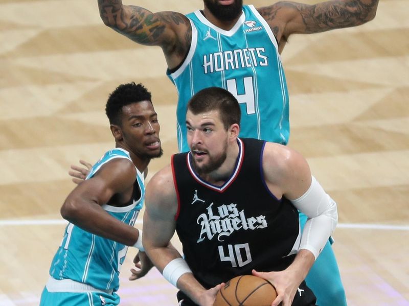 CHARLOTTE, NC - MARCH 31: Ivica Zubac #40 of the LA Clippers drives to the basket during the game against the Charlotte Hornets on March 31, 2024 at Spectrum Center in Charlotte, North Carolina. NOTE TO USER: User expressly acknowledges and agrees that, by downloading and or using this photograph, User is consenting to the terms and conditions of the Getty Images License Agreement.  Mandatory Copyright Notice:  Copyright 2024 NBAE (Photo by Brock Williams-Smith/NBAE via Getty Images)