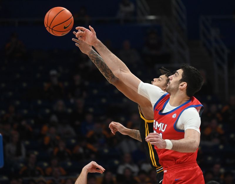 Feb 7, 2026; Pittsburgh, Pennsylvania, USA;  SMU Mustangs center Samet Yigitoglu (24) and Pittsburgh Panthers forward Cameron Corhen (2) take the opening tip-off during the first half  at Petersen Events Center. Mandatory Credit: Philip G. Pavely-Imagn Images