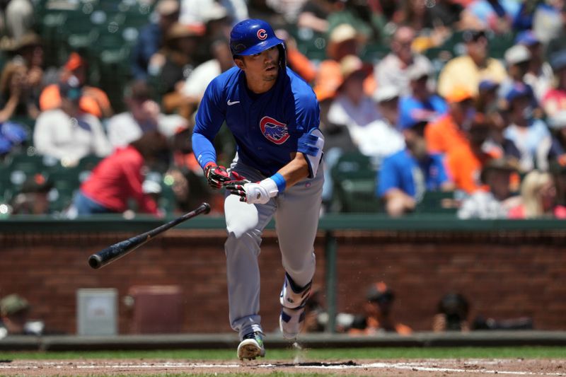 Jun 27, 2024; San Francisco, California, USA; Chicago Cubs left fielder Seiya Suzuki (27) runs to first base after hitting an RBI-triple against the San Francisco Giants during the third inning at Oracle Park. Mandatory Credit: Darren Yamashita-USA TODAY Sports