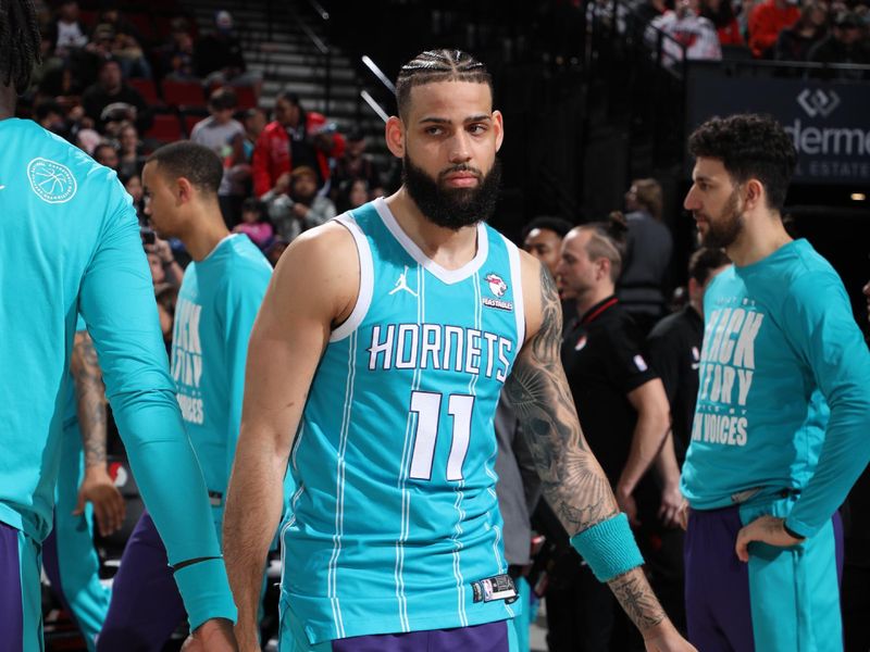 PORTLAND, OR - FEBRUARY 25:  Cody Martin #11 of the Charlotte Hornets walks on the court during player introductions on February 25, 2024 at the Moda Center Arena in Portland, Oregon. NOTE TO USER: User expressly acknowledges and agrees that, by downloading and or using this photograph, user is consenting to the terms and conditions of the Getty Images License Agreement. Mandatory Copyright Notice: Copyright 2024 NBAE (Photo by Cameron Browne/NBAE via Getty Images)