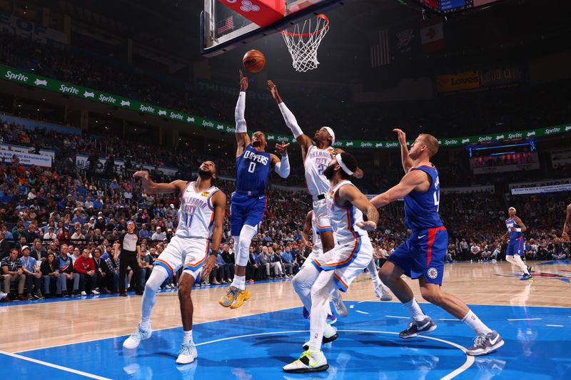 OKLAHOMA CITY, OK - FEBRUARY 22:  Russell Westbrook #0 of the LA Clippers drives to the basket during the game against the Oklahoma City Thunder on February 22SF, 2024 at Paycom Arena in Oklahoma City, Oklahoma. NOTE TO USER: User expressly acknowledges and agrees that, by downloading and or using this photograph, User is consenting to the terms and conditions of the Getty Images License Agreement. Mandatory Copyright Notice: Copyright 2024 NBAE (Photo by Zach Beeker/NBAE via Getty Images)