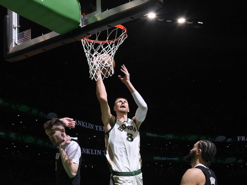 BOSTON, MA - FEBRUARY 4:  Kristaps Porzingis #8 of the Boston Celtics shoots the ball during the game  against the Memphis Grizzlies on February 4, 2024 at the TD Garden in Boston, Massachusetts. NOTE TO USER: User expressly acknowledges and agrees that, by downloading and or using this photograph, User is consenting to the terms and conditions of the Getty Images License Agreement. Mandatory Copyright Notice: Copyright 2024 NBAE  (Photo by Brian Babineau/NBAE via Getty Images)