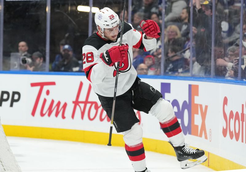 Mar 26, 2024; Toronto, Ontario, CAN; New Jersey Devils right wing Timo Meier (28) celebrates after scoring a goal against the Toronto Maple Leafs during the second period at Scotiabank Arena. Mandatory Credit: Nick Turchiaro-USA TODAY Sports