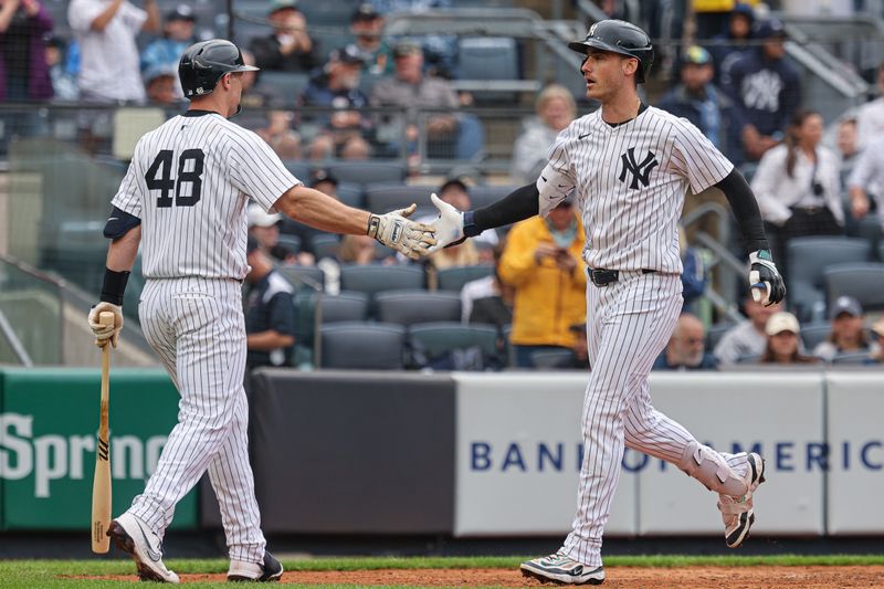 May 4, 2025; Bronx, New York, USA; New York Yankees left fielder Cody Bellinger (35) celebrates his two run home run during the sixth inning with catcher Austin Wells (28) against the Tampa Bay Rays at Yankee Stadium. Mandatory Credit: Vincent Carchietta-Imagn Images