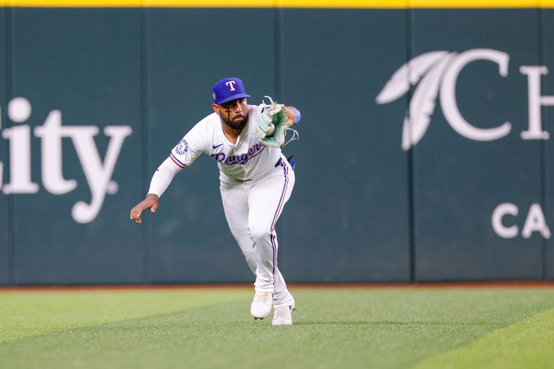 May 13, 2024; Arlington, Texas, USA; Texas Rangers first base Ezequiel Duran (20) catches a line drive during the fifth inning against the Cleveland Guardians at Globe Life Field. Mandatory Credit: Andrew Dieb-USA TODAY Sports