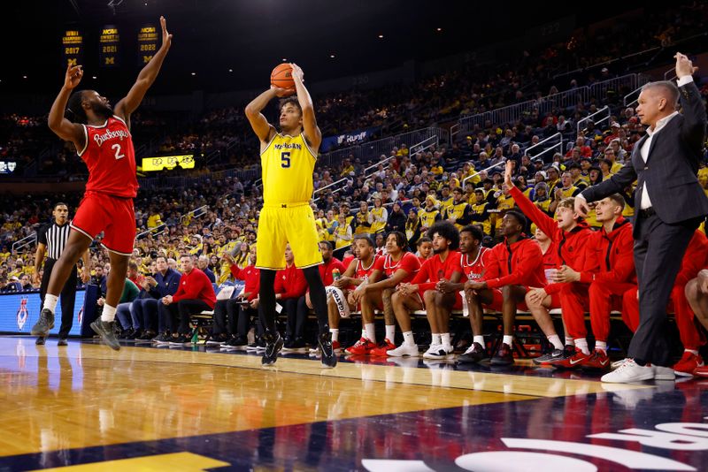 Jan 15, 2024; Ann Arbor, Michigan, USA; Michigan Wolverines forward Terrance Williams II (5) shoots over Ohio State Buckeyes guard Bruce Thornton (2) in the first half at Crisler Center. Mandatory Credit: Rick Osentoski-USA TODAY Sports