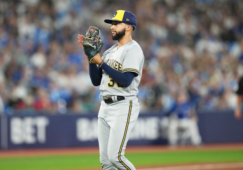 May 31, 2023; Toronto, Ontario, CAN; Milwaukee Brewers relief pitcher Devin Williams (38) celebrates a win against the Toronto Blue Jays at the end of the ninth inning at Rogers Centre. Mandatory Credit: Nick Turchiaro-USA TODAY Sports