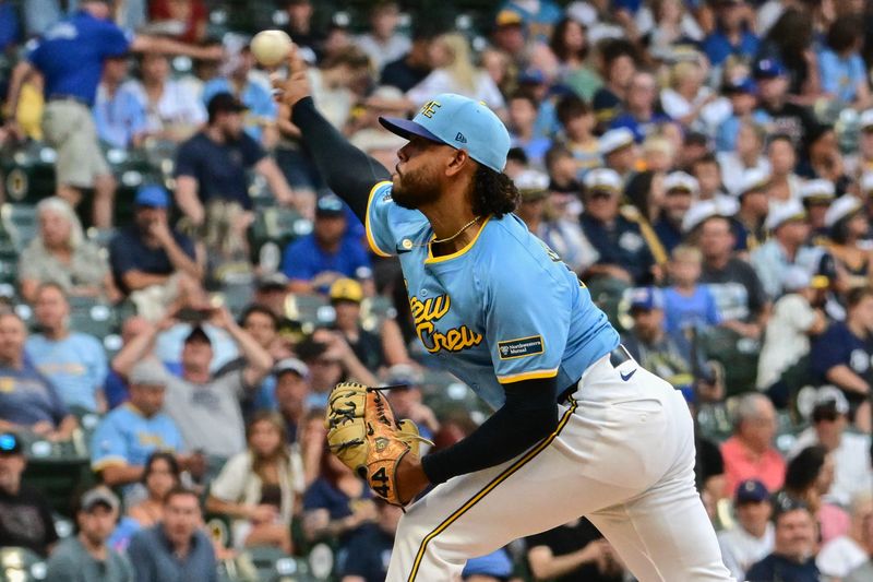 Jul 26, 2024; Milwaukee, Wisconsin, USA;  Milwaukee Brewers starting pitcher Freddy Peralta (51) pitches in the first inning against the Miami Marlins at American Family Field. Mandatory Credit: Benny Sieu-USA TODAY Sports