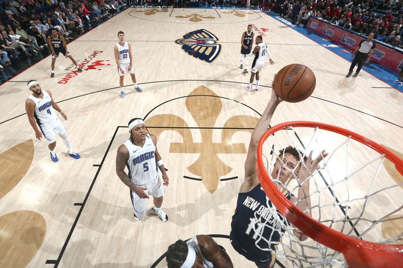 NEW ORLEANS, LA - APRIL 3:  Dyson Daniels #11 of the New Orleans Pelicans drives to the basket during the game against the Orlando Magic on April 3, 2024 at the Smoothie King Center in New Orleans, Louisiana. NOTE TO USER: User expressly acknowledges and agrees that, by downloading and or using this Photograph, user is consenting to the terms and conditions of the Getty Images License Agreement. Mandatory Copyright Notice: Copyright 2024 NBAE (Photo by Layne Murdoch Jr./NBAE via Getty Images)