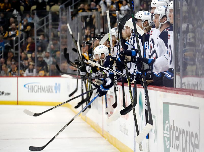 Jan 13, 2023; Pittsburgh, Pennsylvania, USA;  The Winnipeg Jets bench reacts after a fight by defenseman Brenden Dillon (not pictured) against Pittsburgh Penguins left wing Jason Zucker (not pictured) during the third period at PPG Paints Arena. The Jets won 4-1. Mandatory Credit: Charles LeClaire-USA TODAY Sports