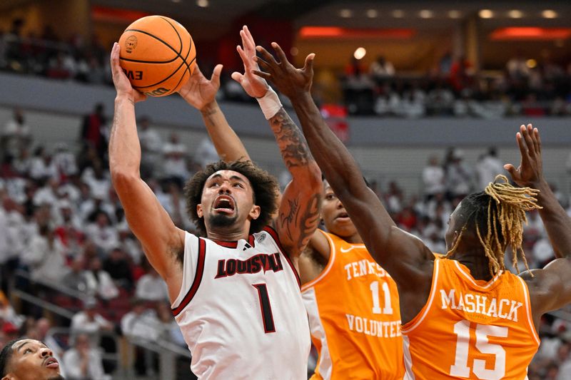 Nov 9, 2024; Louisville, Kentucky, USA;  Louisville Cardinals guard J'Vonne Hadley (1) shoots against Tennessee Volunteers guard Jordan Gainey (11) and guard Jahmai Mashack (15) during the second half at KFC Yum! Center. Tennessee defeated Louisville 77-55. Mandatory Credit: Jamie Rhodes-Imagn Images