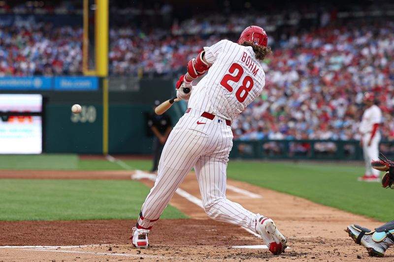 May 3, 2025; Philadelphia, Pennsylvania, USA; Philadelphia Phillies third base Alec Bohm (28) hits a single during the second inning against the Arizona Diamondbacks at Citizens Bank Park. Mandatory Credit: Bill Streicher-Imagn Images