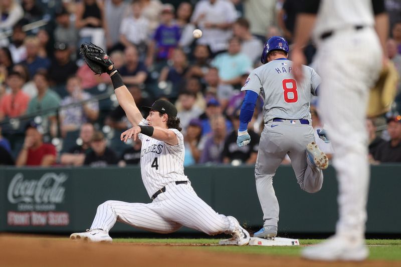 Sep 13, 2024; Denver, Colorado, USA; Colorado Rockies first baseman Michael Toglia (4) is unable to field a throw as Chicago Cubs left fielder Ian Happ (8) reaches first in the third inning at Coors Field. Mandatory Credit: Isaiah J. Downing-Imagn Images