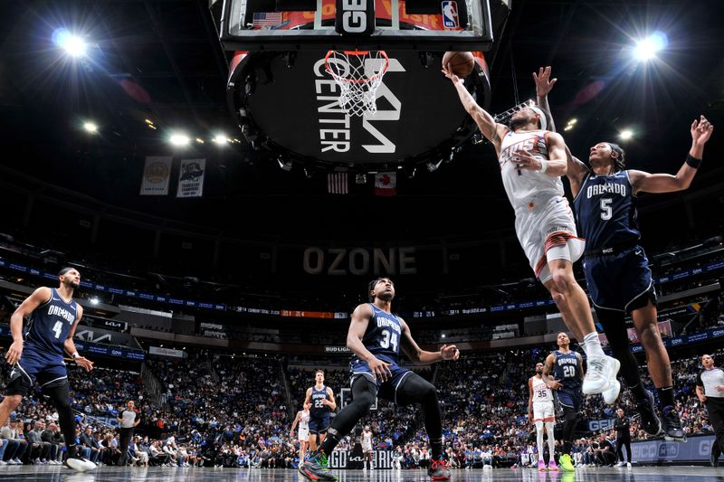 ORLANDO, FL - JANUARY 28: Devin Booker #1 of the Phoenix Suns goes to the basket during the game on January 28, 2024 at Amway Center in Orlando, Florida. NOTE TO USER: User expressly acknowledges and agrees that, by downloading and or using this photograph, User is consenting to the terms and conditions of the Getty Images License Agreement. Mandatory Copyright Notice: Copyright 2024 NBAE (Photo by Fernando Medina/NBAE via Getty Images)