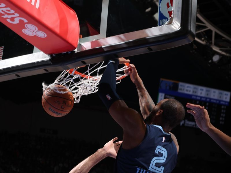 MINNEAPOLIS, MN -  JANUARY 18: Xavier Tillman #2 of the Memphis Grizzlies dunks the ball during the game against the Minnesota Timberwolves on January 18, 2024 at Target Center in Minneapolis, Minnesota. NOTE TO USER: User expressly acknowledges and agrees that, by downloading and or using this Photograph, user is consenting to the terms and conditions of the Getty Images License Agreement. Mandatory Copyright Notice: Copyright 2024 NBAE (Photo by David Sherman/NBAE via Getty Images)