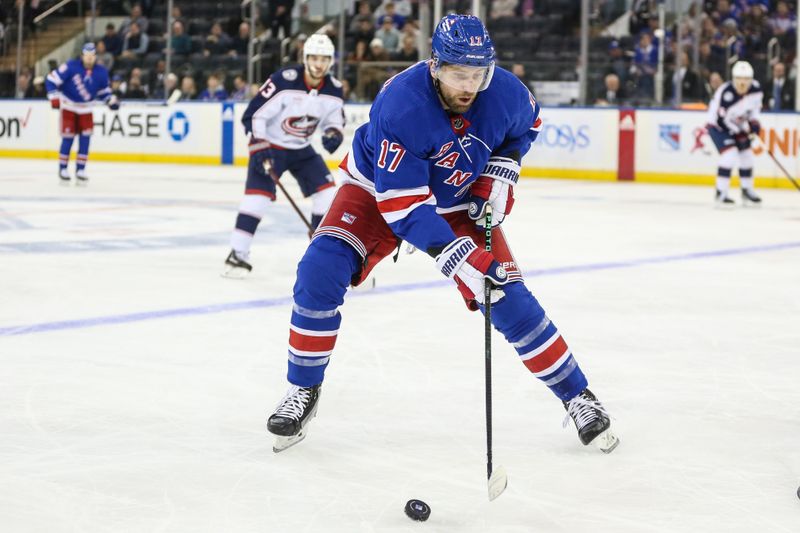 Nov 12, 2023; New York, New York, USA; New York Rangers right wing Blake Wheeler (17) chase down the puck in the first period against the Columbus Blue Jackets at Madison Square Garden. Mandatory Credit: Wendell Cruz-USA TODAY Sports