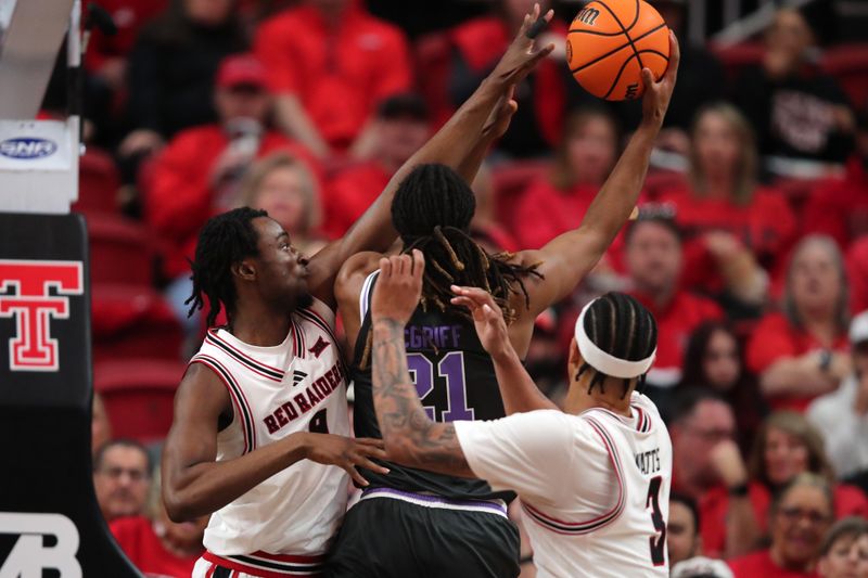 Feb 21, 2026; Lubbock, Texas, USA;  Texas Tech Red Raiders forward Luke Bamgboye (9) tries to block a shot by Kansas State Wildcats Khamari McGriff (21) in the first half at United Supermarkets Arena. Mandatory Credit: Michael C. Johnson-Imagn Images