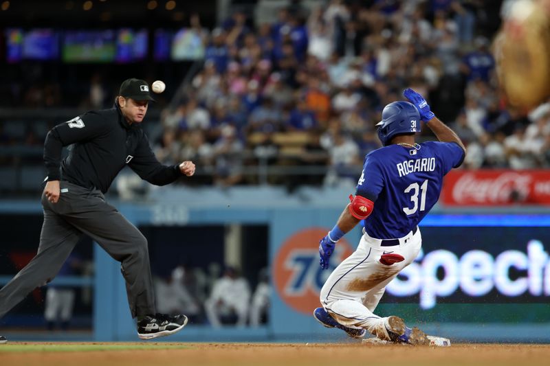 Aug 3, 2023; Los Angeles, California, USA;  Los Angeles Dodgers second baseman Amed Rosario (31) slides to second base on RBI double during the sixth inning against the Oakland Athletics at Dodger Stadium. Mandatory Credit: Kiyoshi Mio-USA TODAY Sports