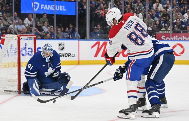 Sep 26, 2024; Toronto, Ontario, CAN;  Toronto Maple Leafs goalie Anthony Stolarz (41) makes a save on a shot from Montreal Canadiens forward Luke Tuch (88) in the second period at Scotiabank Arena. Mandatory Credit: Dan Hamilton-Imagn Images