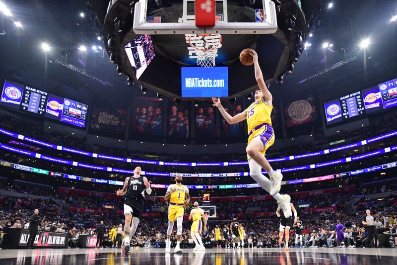 LOS ANGELES, CA - FEBRUARY 28:  Austin Reaves #15 of the Los Angeles Lakers goes to the basket during the game on February 28, 2024 at Crypto.Com Arena in Los Angeles, California. NOTE TO USER: User expressly acknowledges and agrees that, by downloading and/or using this Photograph, user is consenting to the terms and conditions of the Getty Images License Agreement. Mandatory Copyright Notice: Copyright 2024 NBAE (Photo by Adam Pantozzi/NBAE via Getty Images)