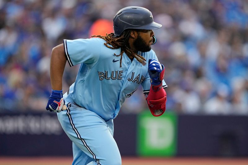 May 30, 2023; Toronto, Ontario, CAN; Toronto Blue Jays first baseman Vladimir Guerrero Jr. (27) runs to first base on an RBI single against the Milwaukee Brewers during the first inning at Rogers Centre. Mandatory Credit: John E. Sokolowski-USA TODAY Sports