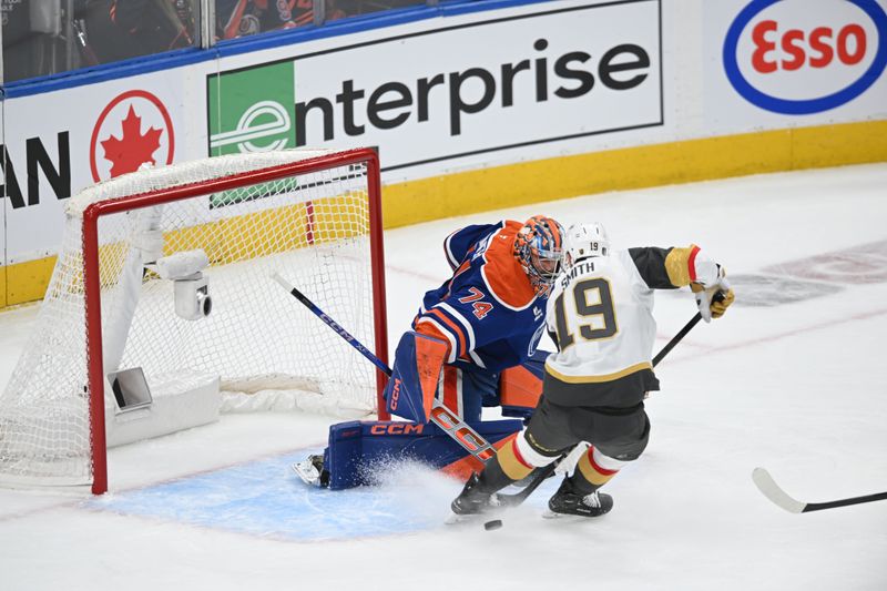 May 10, 2025; Edmonton, Alberta, CAN;  Edmonton Oilers goalie Stuart Skinner (74) battles for the puck with Vegas Golden Knights right winger Reilly Smith (19) during the first period in game three of the second round of the 2025 Stanley Cup Playoffs at Rogers Place. Mandatory Credit: Walter Tychnowicz-Imagn Images