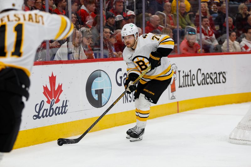 Mar 21, 2026; Detroit, Michigan, USA; Boston Bruins left wing Viktor Arvidsson (71) passes the puck to center Casey Mittelstadt (11) during the first period against the Detroit Red Wings at Little Caesars Arena. Mandatory Credit: Brian Bradshaw Sevald-Imagn Images Mar 21, 2026; Detroit, Michigan, USA; Boston Bruins left wing Viktor Arvidsson (71) passes the puck to center Casey Mittelstadt (11) during the first period against the Detroit Red Wings at Little Caesars Arena. Mandatory Credit: Brian Bradshaw Sevald-Imagn Images