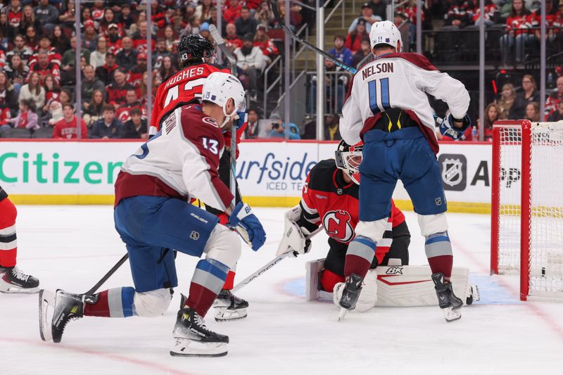 Oct 26, 2025; Newark, New Jersey, USA; Colorado Avalanche right wing Valeri Nichushkin (13) scores a goal on New Jersey Devils goaltender Jake Allen (34) during the first period at Prudential Center. Mandatory Credit: Ed Mulholland-Imagn Images