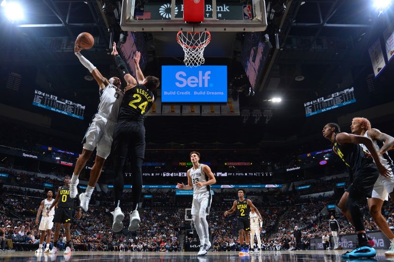 SAN ANTONIO, TX - OCTOBER 12: Keldon Johnson #0 of the San Antonio Spurs dunks the ball during the game against the Utah Jazz during a NBA preseason game on October 12, 2024 at the Frost Bank Center in San Antonio, Texas. NOTE TO USER: User expressly acknowledges and agrees that, by downloading and or using this photograph, user is consenting to the terms and conditions of the Getty Images License Agreement. Mandatory Copyright Notice: Copyright 2024 NBAE (Photos by Michael Gonzales/NBAE via Getty Images)