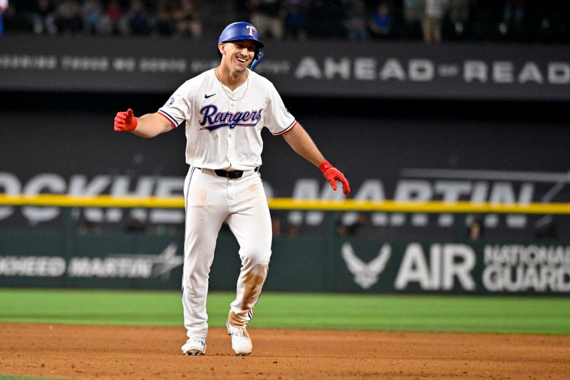 Aug 21, 2024; Arlington, Texas, USA; Texas Rangers left fielder Wyatt Langford (36) celebrates after driving in the game winning run by pinch runner Ezequiel Duran (not pictured) against the Pittsburgh Pirates during the ninth inning at Globe Life Field. Mandatory Credit: Jerome Miron-USA TODAY Sports