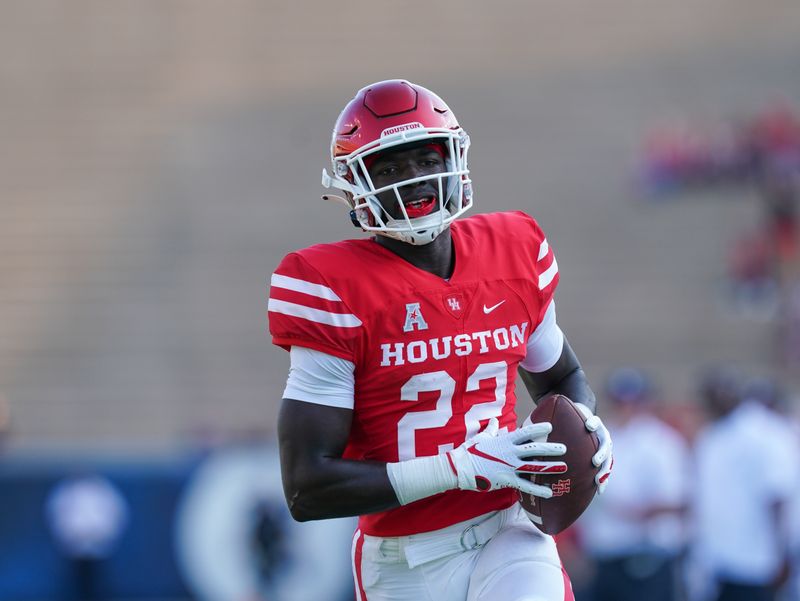 Sep 11, 2021; Houston, Texas, USA;  Houston Cougars running back Alton McCaskill (22) runs in for a score in the first half against the Rice Owls at Rice Stadium. Mandatory Credit: Daniel Dunn-USA TODAY Sports