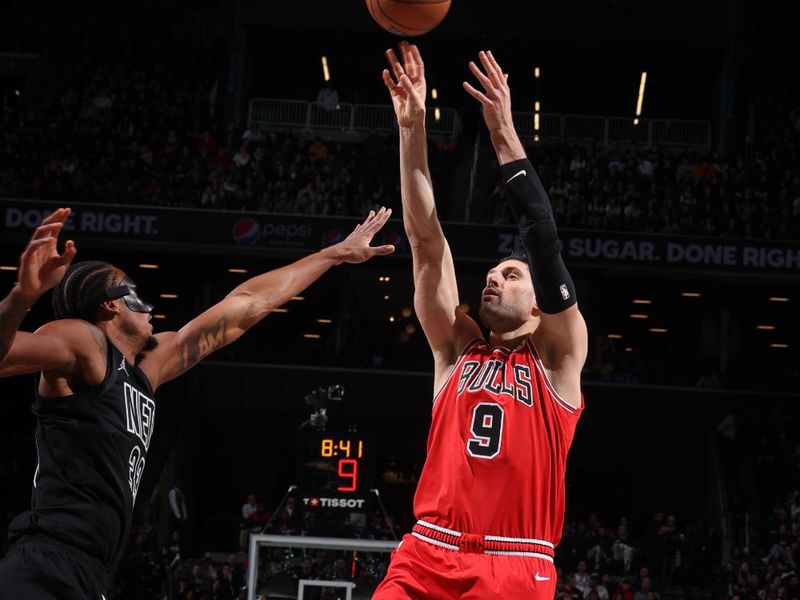 BROOKLYN, NY - MARCH 29: Nikola Vucevic #9 of the Chicago Bulls shoots the ball during the game against the Brooklyn Nets on March 29, 2024 at Barclays Center in Brooklyn, New York. NOTE TO USER: User expressly acknowledges and agrees that, by downloading and or using this Photograph, user is consenting to the terms and conditions of the Getty Images License Agreement. Mandatory Copyright Notice: Copyright 2024 NBAE (Photo by Nathaniel S. Butler/NBAE via Getty Images)