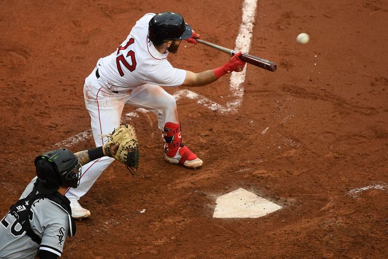 Sep 24, 2023; Boston, Massachusetts, USA; Boston Red Sox second baseman Enmanuel Valdez (47) bunts the ball during the fifth inning against the Chicago White Sox at Fenway Park. Mandatory Credit: Bob DeChiara-USA TODAY Sports