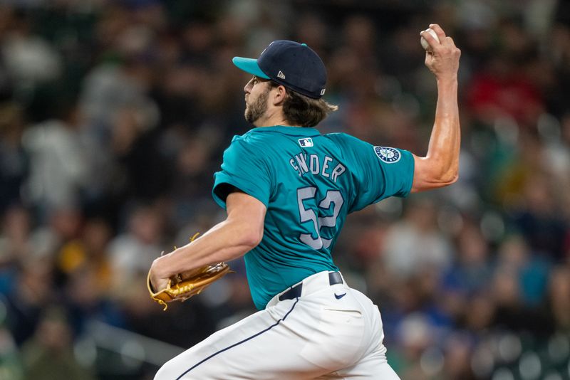 Sep 28, 2024; Seattle, Washington, USA; Seattle Marinerss reliever Collin Snider (52) delivers a pitch during the ninth inning against the Oakland Athletics at T-Mobile Park. Mandatory Credit: Stephen Brashear-Imagn Images