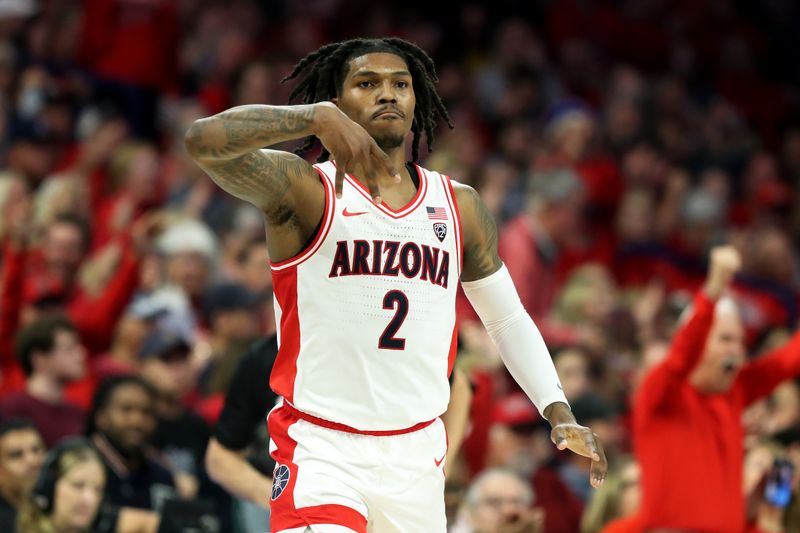 Feb 17, 2024; Tucson, Arizona, USA; Arizona Wildcats guard Caleb Love (2) makes a three point basket against the Arizona State Sun Devils and then celebrates with the Arizona Wildcats bench by signaling a forks down during the first half at McKale Center. Mandatory Credit: Zachary BonDurant-USA TODAY Sports