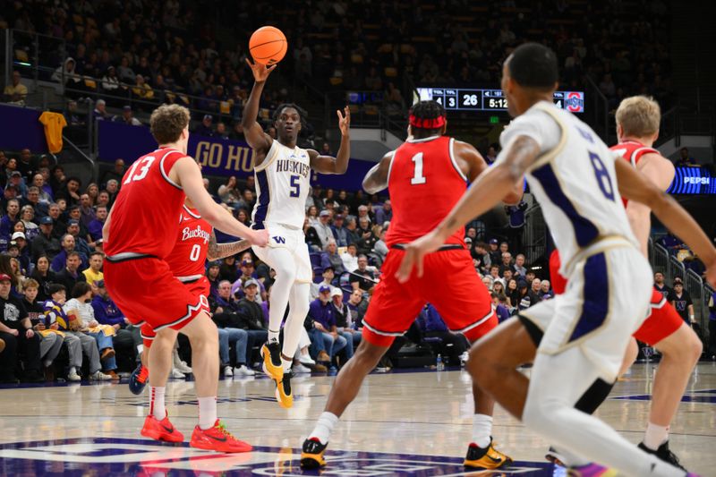 Jan 11, 2026; Seattle, Washington, USA; Washington Huskies guard Zoom Diallo (5) passes the ball to forward Bryson Tucker (8) during the first half against the Ohio State Buckeyes at Alaska Airlines Arena at Hec Edmundson Pavilion. Mandatory Credit: Steven Bisig-Imagn Images