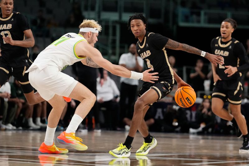 Mar 16, 2024; Fort Worth, TX, USA;  UAB Blazers guard Eric Gaines (4) dribbles the ball up court as South Florida Bulls forward Kasean Pryor (11) defends during the first half at Dickies Arena. Mandatory Credit: Chris Jones-USA TODAY Sports