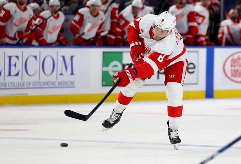 Oct 26, 2024; Buffalo, New York, USA;  Detroit Red Wings defenseman Ben Chiarot (8) takes a shot on goal during the third period against the Buffalo Sabres at KeyBank Center. Mandatory Credit: Timothy T. Ludwig-Imagn Images